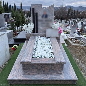 Granite grave with white stones
