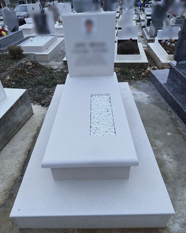 White marble grave installed at the cemetery